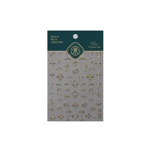 Stickers à ongles 5D dorés avec motifs célestes soleil lune et détails en strass