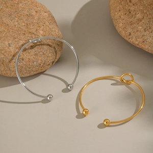 Bracciali rigidi aperti in acciaio inossidabile placcato oro 18K con nodo e perline