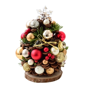 Mini pine cone Christmas tree tabletop decor with red berries and golden ribbon bow