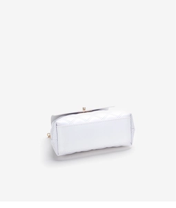 Detail view of the white quilted leather bag bottom with golden metal accents and fine stitching
