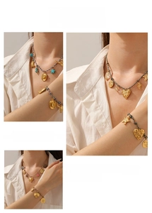 Detail of bohemian gold pendants with braided ropes showing layered necklace and bracelet sets