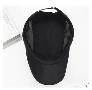 Detail of breathable mesh panel and adjustable metal buckle on black quick-dry cap