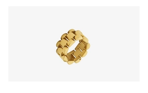 Detailed macro view of gold-toned titanium steel ring with watch band link design