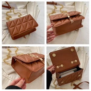 Macro detail of brown quilted chain crossbody bag showing spacious interior and texture