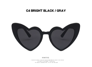 Close-up of heart-shaped sunglasses in C4 bright black frame with gray tinted lenses