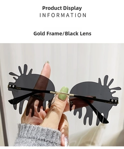 Detail of gold frame sunglasses with unique black-grey teardrop fluid shaped lenses