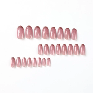Pink gradient French press-on nails with fine glitter finish in an oval shape set of 24