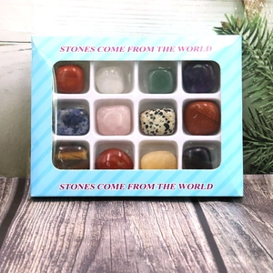 Detailed gift box featuring twelve assorted natural polished gemstones in a blue window pack