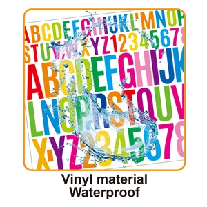 Close-up of waterproof vinyl letter stickers showing splash resistance on white background