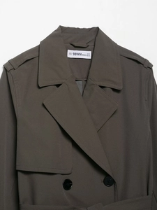 Detail of dark grey double-breasted trench coat neck with buttons and epaulets