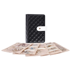 Close-up of black quilted leather jewelry binder with transparent PVC zipper bags