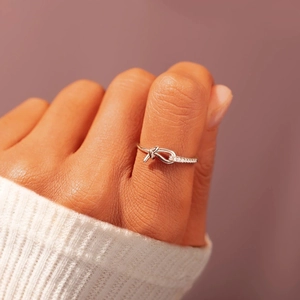 Elegant S925 sterling silver knotted ring with pavé cubic zirconia for women
