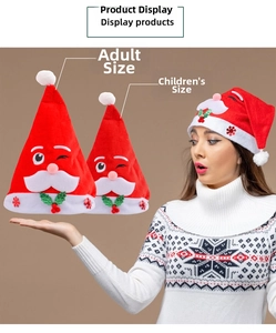 Detail of adult and kids plush Santa hats with holly leaf and berry decorations