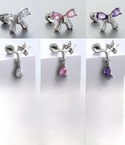 Detail of titanium steel butterfly and star earrings with colorful zircon pendants