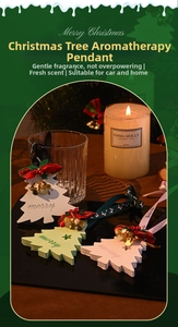 Macro detail of Christmas tree scented gypsum ornaments with handmade ribbon and bell