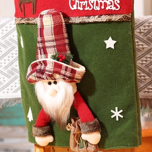 Detail of 3D Santa Claus chair cover with felt fabric and Christmas embroidery