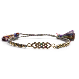 Adjustable woven bracelet with colorful zircons and golden tassels for women