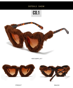Detail view of heart-shaped sunglasses with brown faux fur trim and tortoiseshell temples