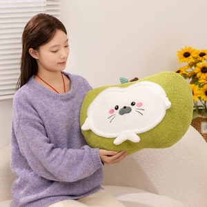 Cute green seal apple plush pillow held by a woman on a cozy sofa in a home setting