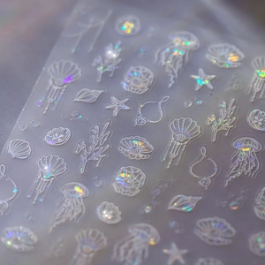 Holographic ocean nail stickers featuring white outline jellyfish shell and starfish designs