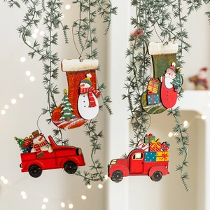 Painted wooden Christmas ornaments featuring Santa, snowman, and truck for festive tree decor