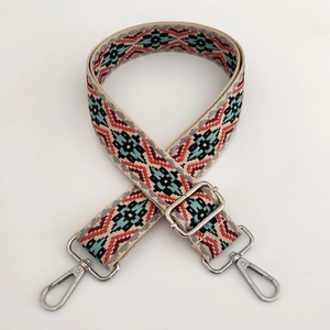 Detail of adjustable 3.8cm wide jacquard bag strap with silver metal buckles and bohemian pattern