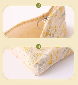 Detail view of cotton-linen pouch with floral embroidery and durable zipper stitching