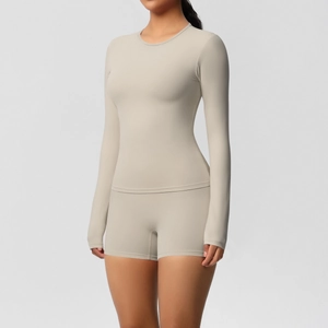 Detail of soft brushed fabric on two-piece yoga set with long sleeve top and high waist shorts