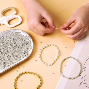 DIY jewelry kit with gold and silver spacer beads pearls and elastic cord for bracelets