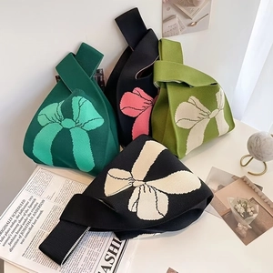 Knit wrist tote bag with bow design in dark green, black, and beige color options