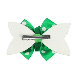 Green polka dot glitter bow hair clip for girls with a silver metal alligator clip base