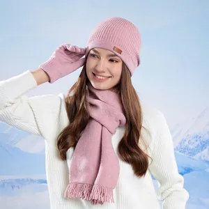 Winter knit set for women including a warm hat, scarf, and gloves in soft lotus pink