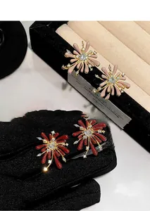Macro view of fireworks studs with red enamel and brilliant white zirconia center