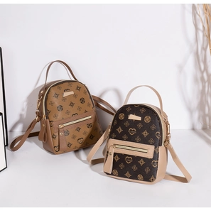 Close-up of mini double-layer backpacks with floral pattern and leather straps