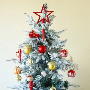 Christmas tree ornaments set with red and gold balls, star topper and diverse festive baubles