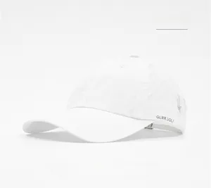 Detail of white quick-dry golf cap featuring triangular breathable laser-cut side vents