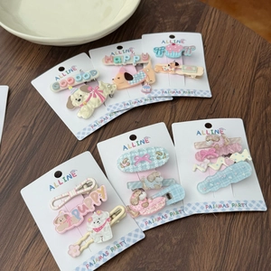 Flat lay of multiple acrylic dog and star hair clips in diverse cute themes and colors