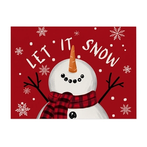 Christmas snowman placement with Let It Snow art print and festive snowflake patterns