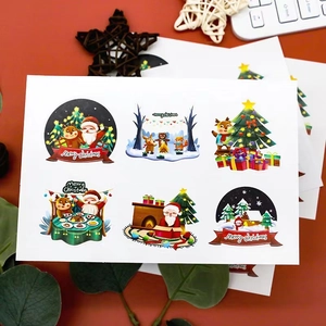 Holiday stickers with Santa and reindeer on a deep red festive backdrop