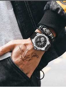 Waterproof sports watch on wrist featuring dual display and black silicone strap