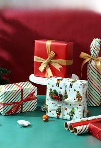 Detailed Christmas gift wrapping set with nutcracker prints and decorative ribbons