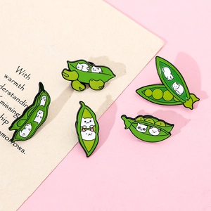 Set of five cute cat pea pod enamel pins in vibrant green and white cartoon design