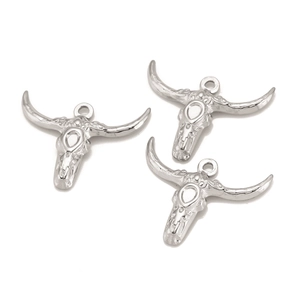 Three silver stainless steel bull head skull charms with horns on a white background