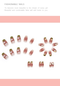 Detail of pink gradient press-on nails with tulip art and 3D butterfly charms