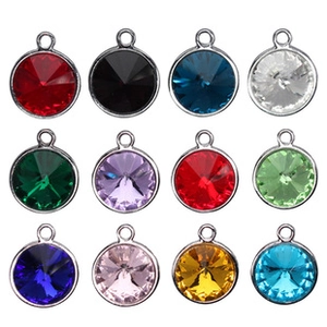Grid layout of twelve colorful round crystal pendants with silver metal frames and loops