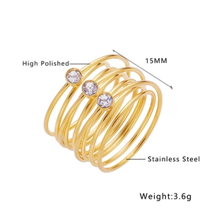 Detail of high polished 18k gold plated stainless steel ring with three clear stones