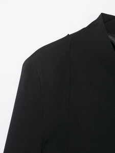 Detailed close-up of the high neck collar and left shoulder of this black slim fit blazer