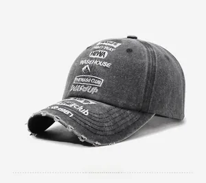 Close-up of vintage charcoal baseball cap with distressed details and street embroidery