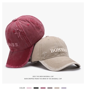 Detailed close-up of embroidered vintage washed cotton baseball caps with distressed holes