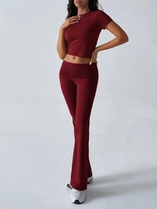 Detail of wine red short sleeve crop top and flared trousers two-piece casual outfit